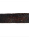 Close-up of rectangular, dark brown wooden antique Chinese rice mold with worn surface.