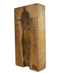 Close-up of an antique wooden Chinese rice mold, rectangular, carved with a hollowed-out human figure in the center.