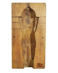 Brown wooden antique Chinese rice mold with intricate carved details, nude female figure, rear view, close-up.