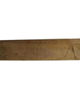 Brown wooden antique Chinese rice mold with 18 plum blossom cavities, long rectangular shape, on a white background.