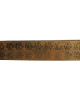 Brown wooden antique Chinese rice mold with eighteen plum blossom cavities, close-up on white background.