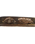 Brown wood Chinese rice mold with longevity symbol and sacred fungus motif, close-up on plain background.