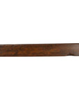 Dark brown wood rectangular rice mold with visible grain on a white background.