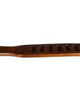 Brown wooden antique Chinese rice mold with five rectangular slots, close-up on plain background.