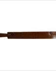 Close-up of antique Chinese rice mold, flat rectangular wooden paddle with small handle on the left side, wood texture.