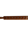 Dark wood antique Chinese rice mold with seven rectangular and diamond carvings, close-up on plain background.