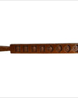 Dark wood antique Chinese rice mold with seven rectangular and diamond carvings, close-up on plain background.