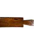 Brown antique Chinese rice mold with geometric eight-shape design against a plain white background.