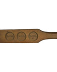 Light wood antique Chinese rice mold with three round character stamps, close-up, used for shaping food.
