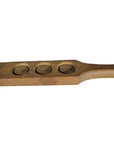 Light wood antique Chinese rice mold with three round character stamps, close-up.