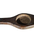 Brown wood Chinese rice mold with round motif, braided rim, carved handle, and floral design, close-up view.
