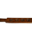 Brown wooden antique Chinese rice mold with handle and five leaf bud impressions, displayed on a neutral background.