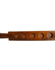 Brown antique wooden Chinese rice mold with five spiral floral cavities and side handle on a white background.