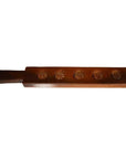 Dark wood antique Chinese rice mold with five spiral floral spiral cavities on a white background.