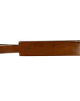 Brown antique Chinese rice mold with six rectangular motifs and incised characters, close-up on white background.