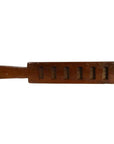 Close-up of antique Chinese rice mold, carved wood with six rectangular motifs and incised Chinese characters.