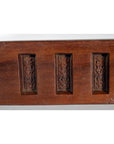 Brown wooden antique Chinese rice mold with six character cavities, curved paddle shape, close-up on plain background.