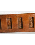 Close-up of dark wood antique Chinese rice mold with six rectangular seal carvings.