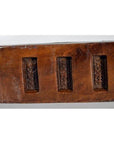 Dark wood antique Chinese rice mold with six rectangular seal carvings, close-up view.
