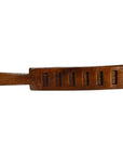Dark-finished antique Chinese rice mold with six rectangular seal carvings, close-up view.