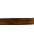 Brown wooden antique Chinese rice mold with mixed symbol carvings and five cavities on a plain white background.
