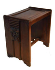 Brown rosewood side table with carved floral and panel details, shown on a white background.