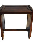 Dark rosewood side table with a rectangular top, raised edges, and sturdy legs with horizontal support.