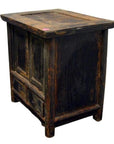 Dark wood Chinese side cabinet with rustic finish and drawer, vintage-style furniture close-up.