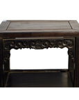 Brown wood antique Chinese coffee table with hand-carved front details and open lower shelf, white background.