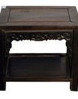 Dark wood Chinese coffee table with ornate hand-carved apron and lower shelf, front view on white background.