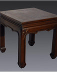 Brown wood Chinese antique square side table with horse hoof legs and beveled top against a gray background.