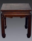 Dark wood Chinese antique square side table with horse hoof legs and crack on left front edge, gray background.