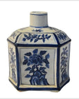 White ceramic hexagonal sake bottle with blue floral designs, antique Chinese Taisho, close-up view.