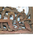 Close-up of antique Chinese wood temple carving with intricate floral and scrollwork patterns, delicate detailed design.