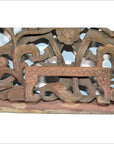 Close-up of antique wooden Chinese temple carving with intricate floral and leaf patterns, empty rectangular center frame.