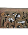 Close-up of antique Chinese temple carving with intricate floral and leaf patterns, white background.