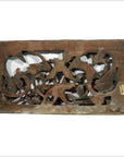 Dark wood rectangular panel with weathered floral and animal carvings, antique finish, rustic appearance.