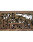 Brown wooden rectangular panel with intricate floral and vine carvings, antique Chinese temple art, close-up.
