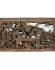 Brown wooden rectangular panel with intricate floral and vine carvings, antique Chinese temple art, close-up.