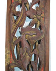 Close-up of antique Chinese vertical peony spray carving in warm natural wood, detailed floral design visible.