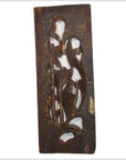 Brown wooden rectangular panel with abstract carved shapes, rustic finish, vertical peony spray design, close-up view.