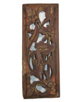 Close-up of reddish-brown wood Chinese carving with vertical peony spray and intricate floral and leaf patterns.