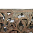 Close-up of antique wooden Chinese temple carving with intricate floral and leaf patterns, vintage detail visible.