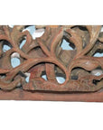 Light wood panel with intricate leaf and vine carving, antique Chinese temple art, close-up view.