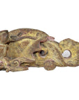 Close-up of antique bronze Chinese temple carving with intricate dragon details and weathered surface.