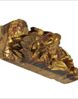 Close-up of gilded wood Chinese temple carving with gold and red floral and leaf patterns.