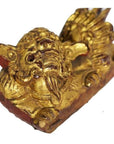 Close-up of dragon-shaped antique Chinese temple carvings, carved wood, pair on rectangular bases against white background.