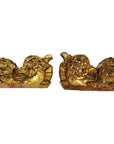 Antique Chinese dragon-shaped wood temple carvings, pair facing each other on a white background.