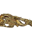 Close-up of gold and red wood Chinese temple carvings, featuring ornate mythical creatures and intricate detailing.