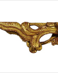 Close-up of gold and white antique Chinese temple carvings with swirling leaf patterns, pair shown.